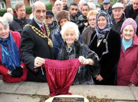 Survivor of war bombing horror Doreen Highland unveils the plaque with Mayor Coun Fida Hussain